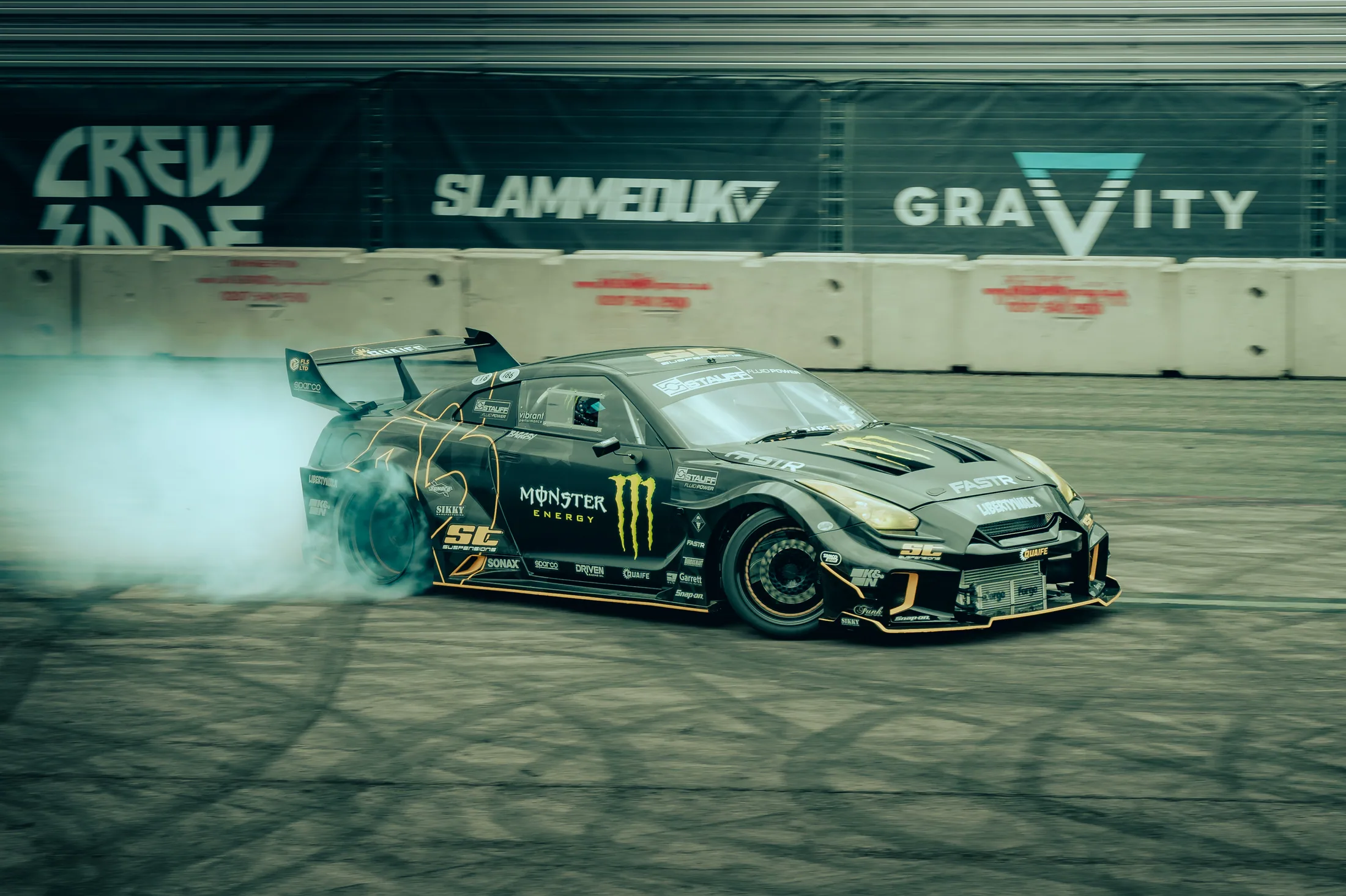 Drift car moving through tyre smoke