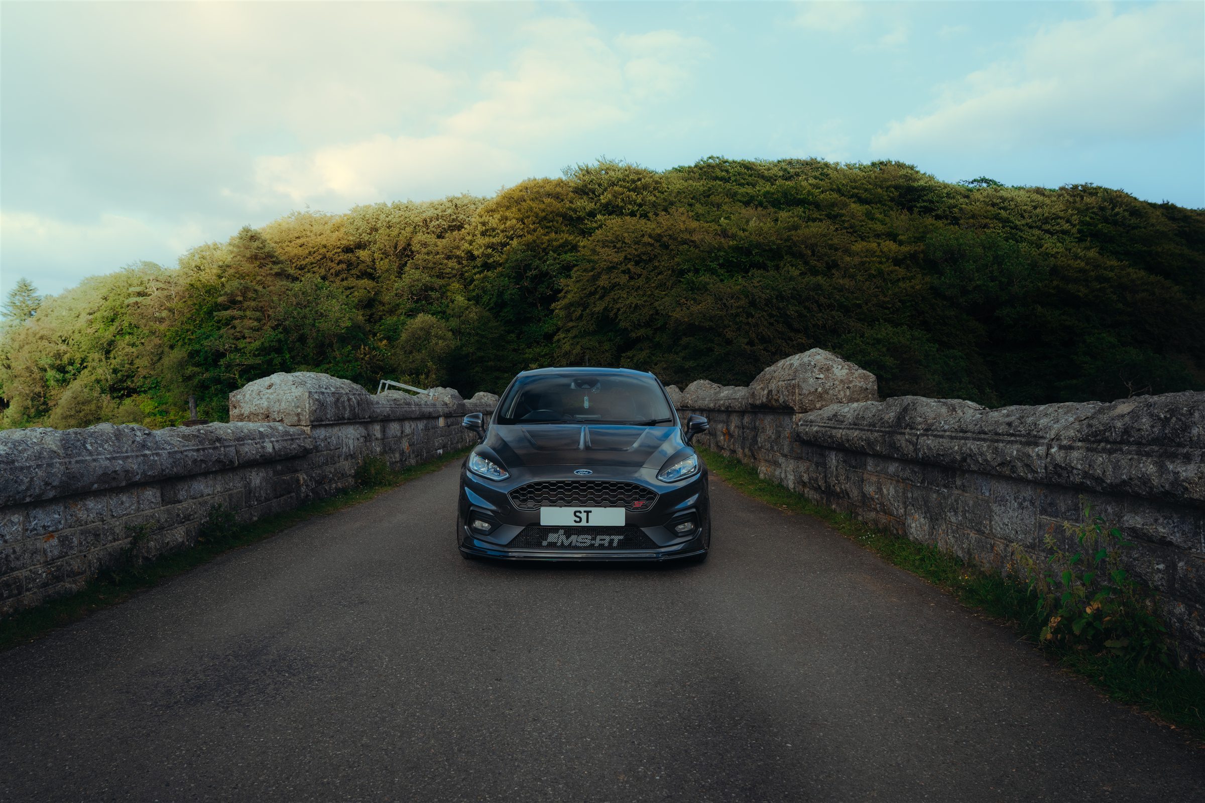 Ford Fiesta ST centred on a stone bridge